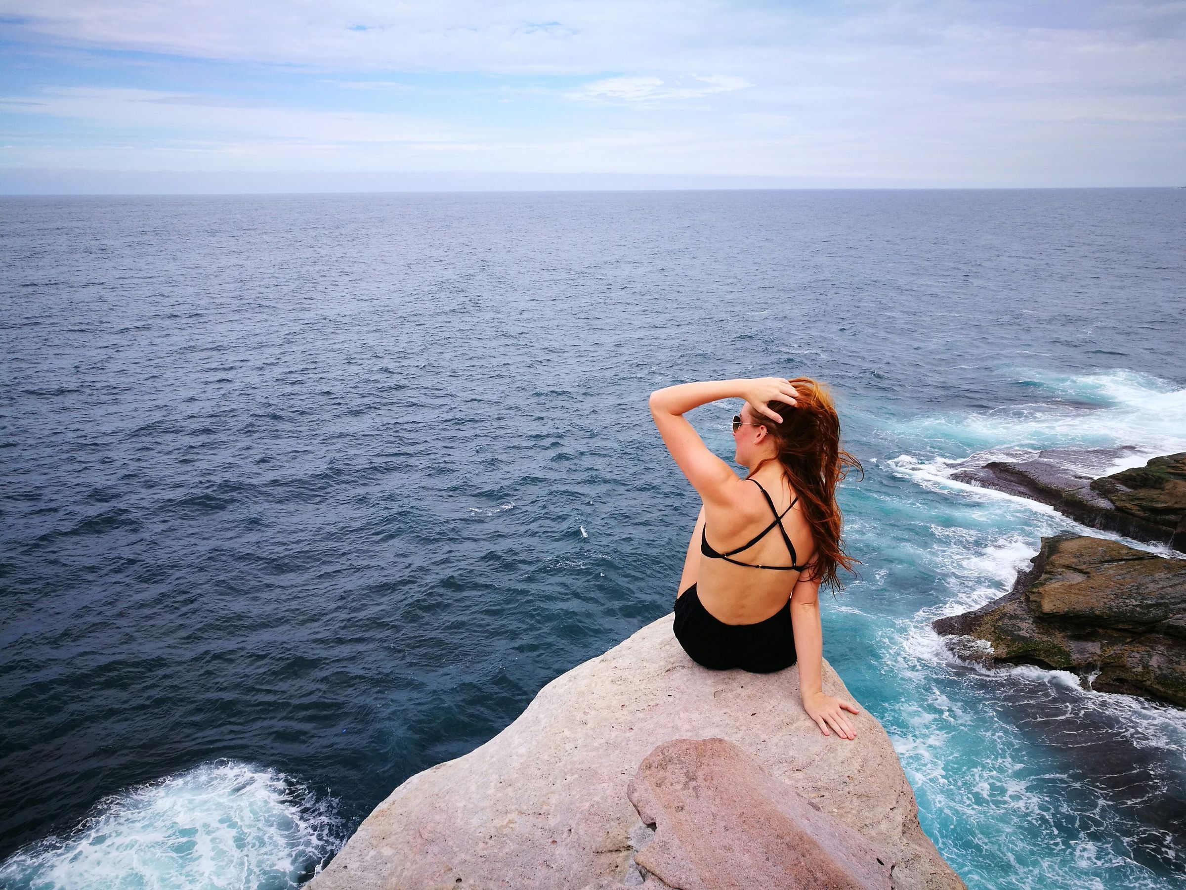 Swimmer on the rocks at Clovelly