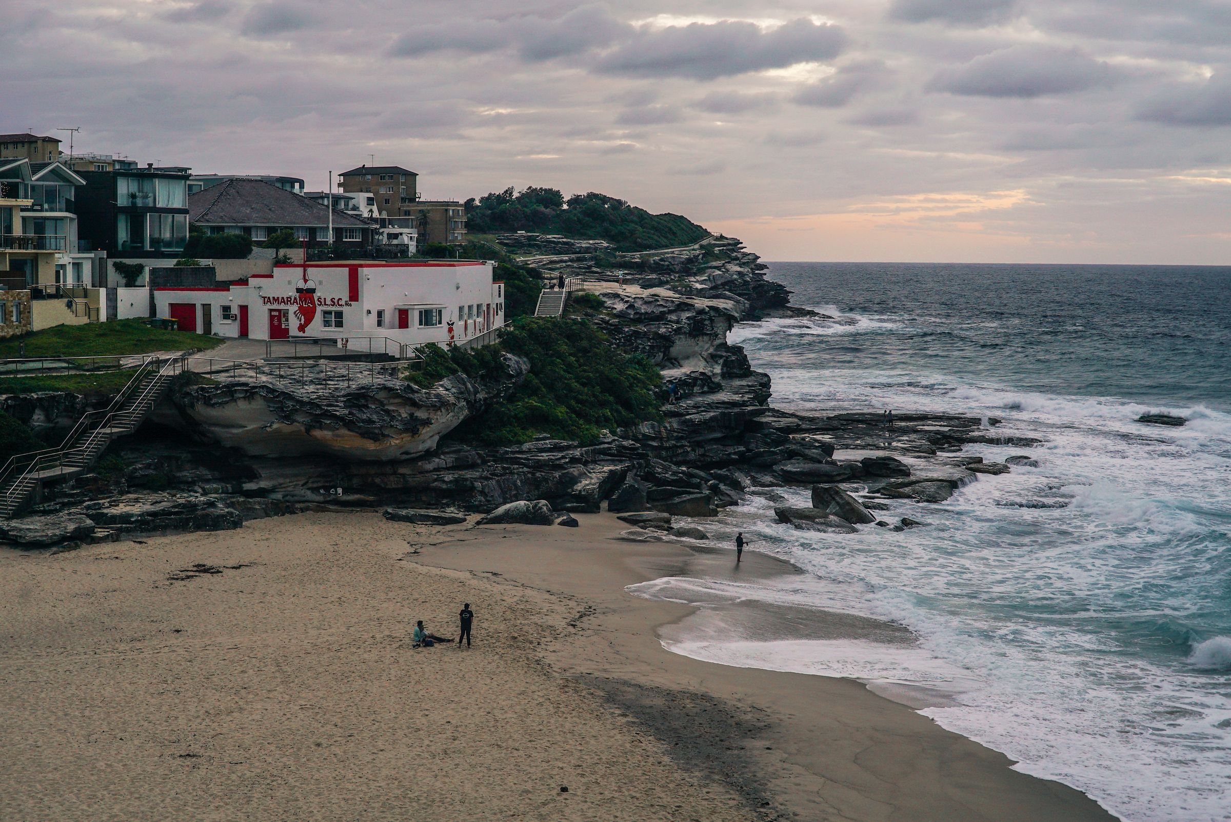 Tamarama Beach with houses on the cliffs above